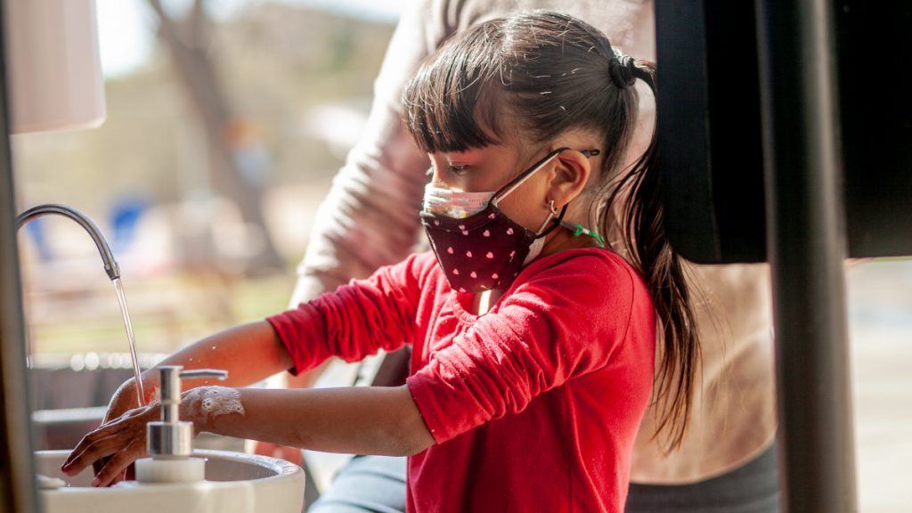 iLEAD Agua Dulce learner washes hands